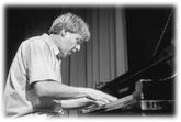 John Ballantyne playing piano.